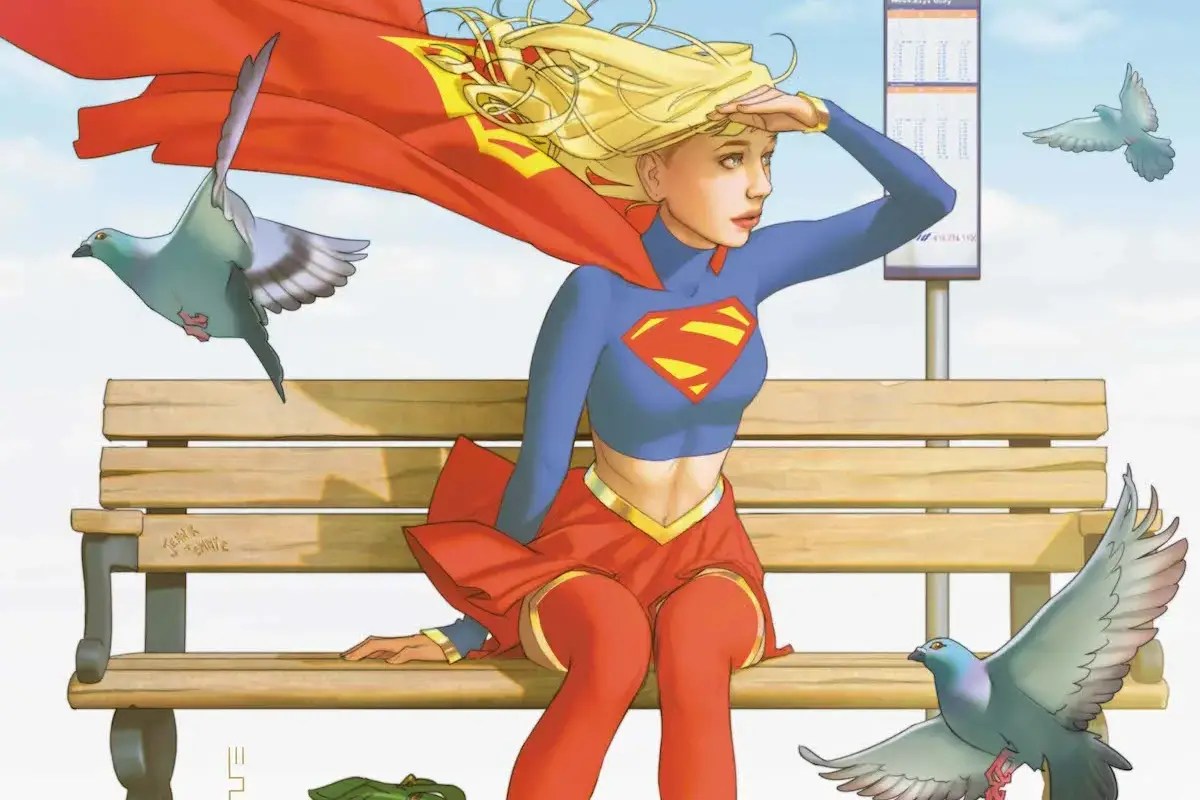 Supergirl sits on a bench surrounded by pigeons in variant cover