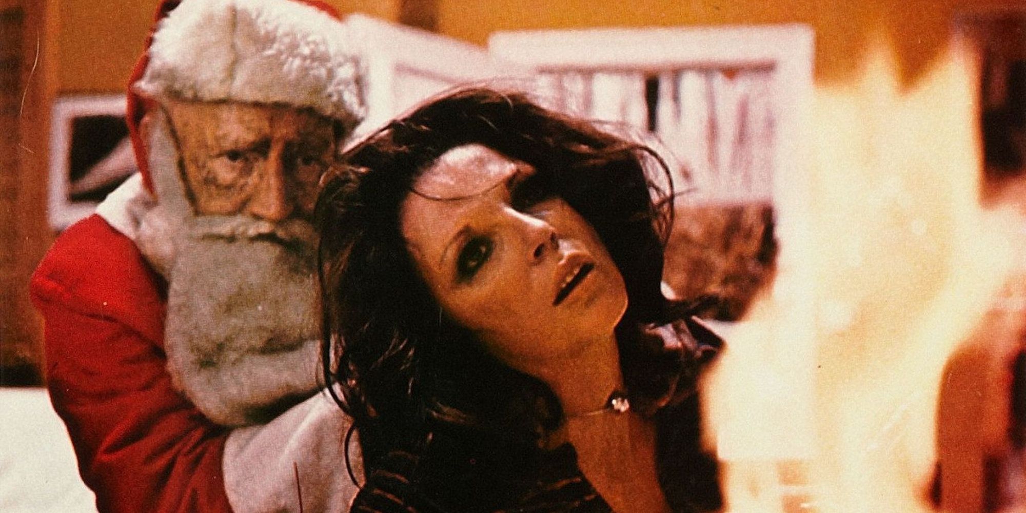 The killer Santa (Oliver MacGreevy) attacks Joanne (Joan Collins) in 'Tales From the Crypt'