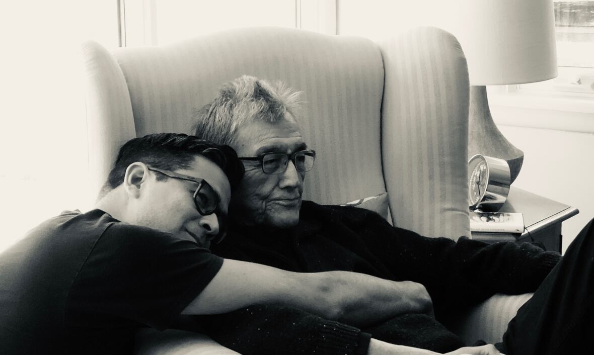 David A. Robertson and his dad, two men of Norway House Cree Nation heritage hugging in black and white.