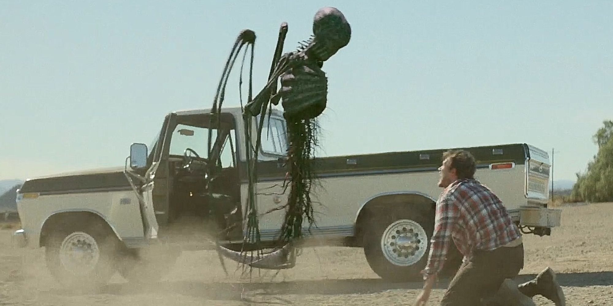 An evil spirit hovers over a kneeling man in 'Southbound'