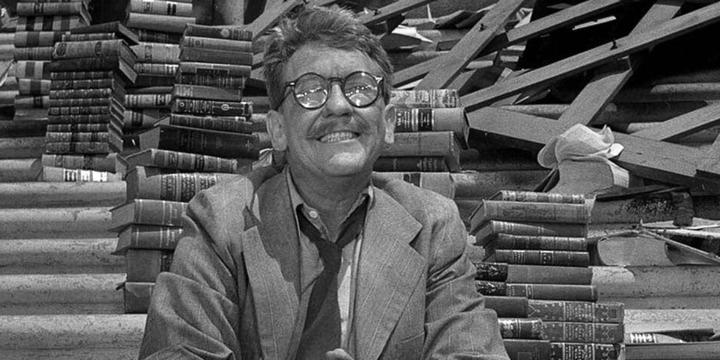 Burgess Meredith as Henry Bemis surrounded by stacks of books in Time Enough At Last from The Twilight Zone.