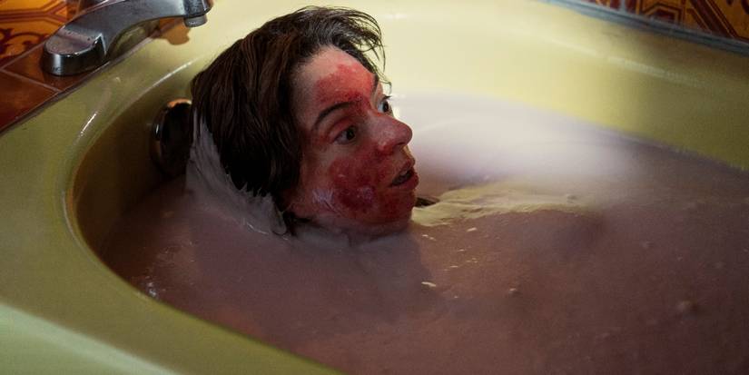 Kate Miccuci submerged up to her neck in a bathtub filled with pink lotion in "The Outside"