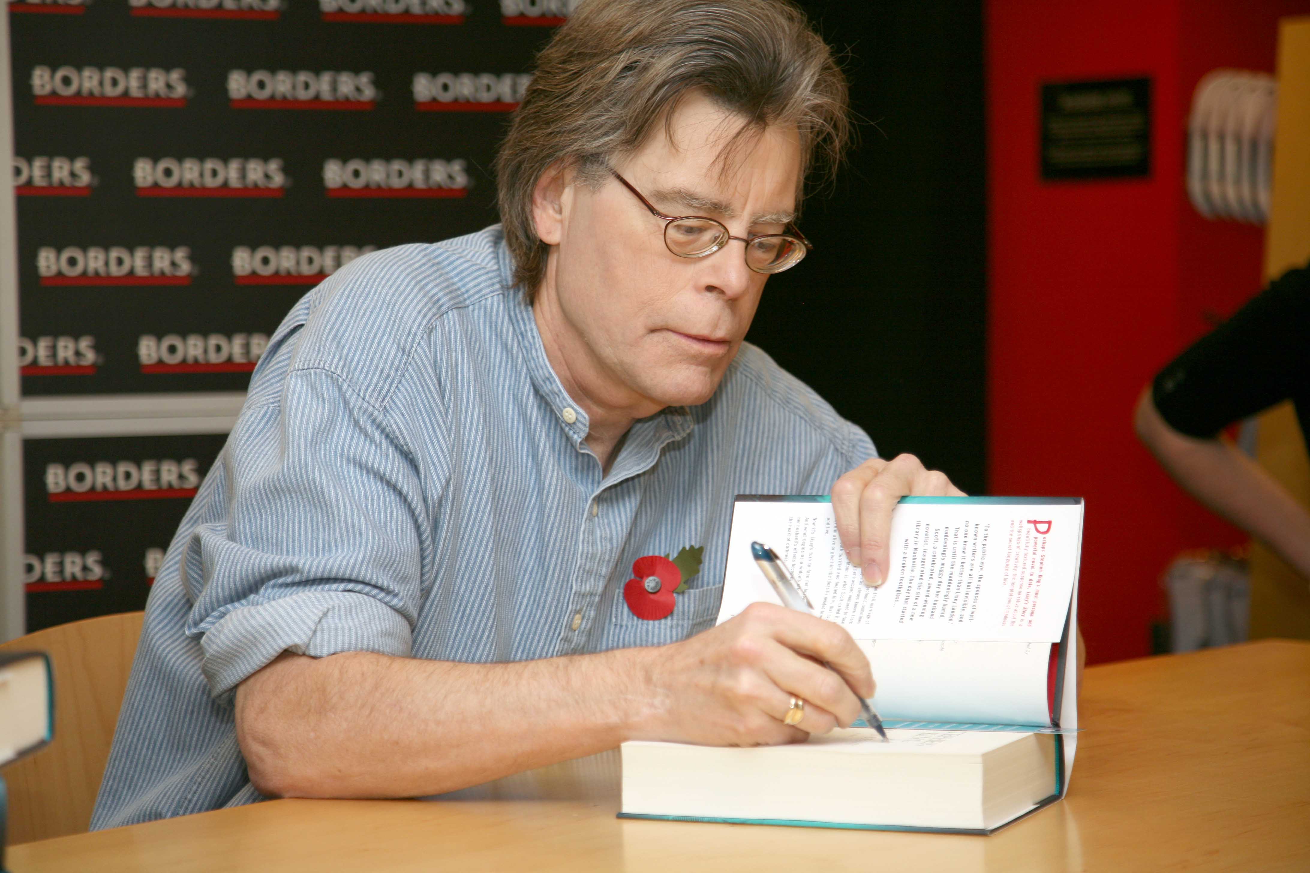 King pictured signing a book at an Oxford Street store in 2006